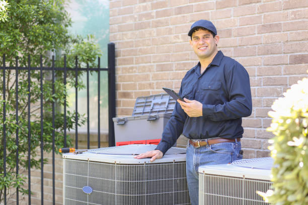 Air conditioner repairman working at residential home